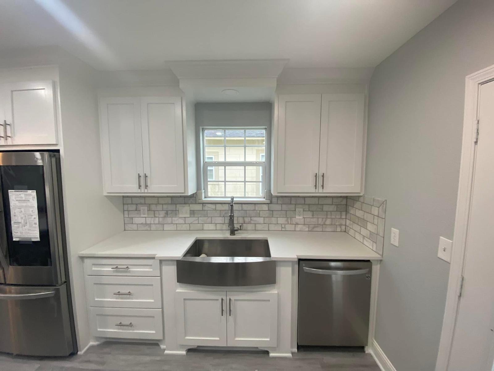 Compact kitchen with marble backsplash Kitchen sink and marble tile backsplash in a Sugar Land TX kitchen renovation